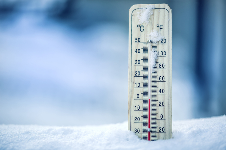 Thermometer on snow shows low temperatures - zero. Low temperatures in degrees Celsius and fahrenheit. Cold winter weather - zero celsius thirty two farenheit Getty Images/iStockphoto